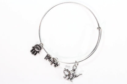 Silver Tone Charm Bangle with Hamsa Hand, Hope, and Genie Lamp Charms