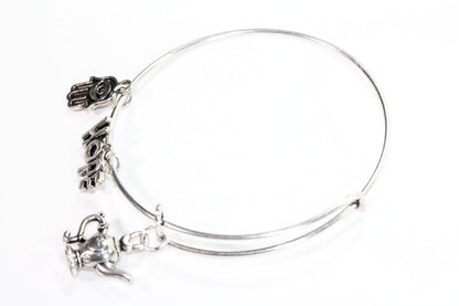 Silver Tone Charm Bangle with Hamsa Hand, Hope, and Genie Lamp Charms