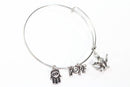 Silver Tone Charm Bangle with Hamsa Hand, Hope, and Genie Lamp Charms